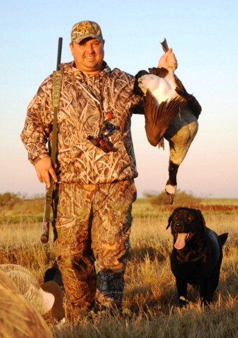 North Texas waterfowl outfitter J.J. Kent shows a September honker taken during the early Canada season goose season. Before the day was done, Kent's Labrador retriever Bo had fetched a three-man limit to hand.